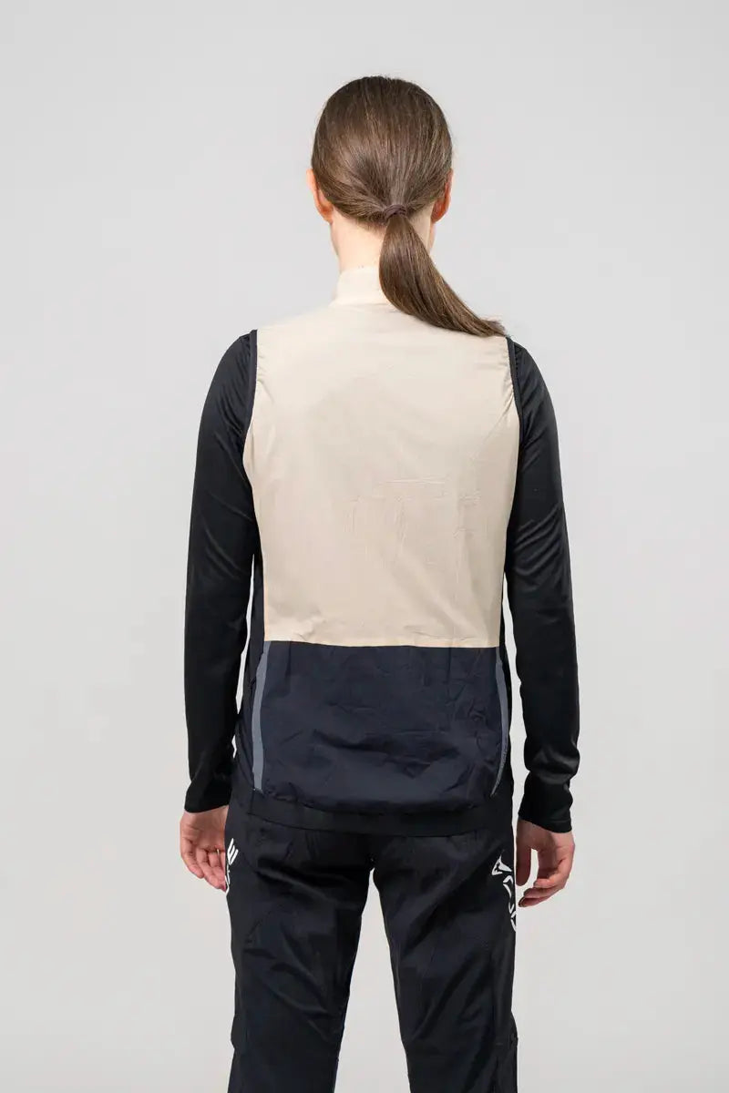 Photo of the back of a women wearing a vest